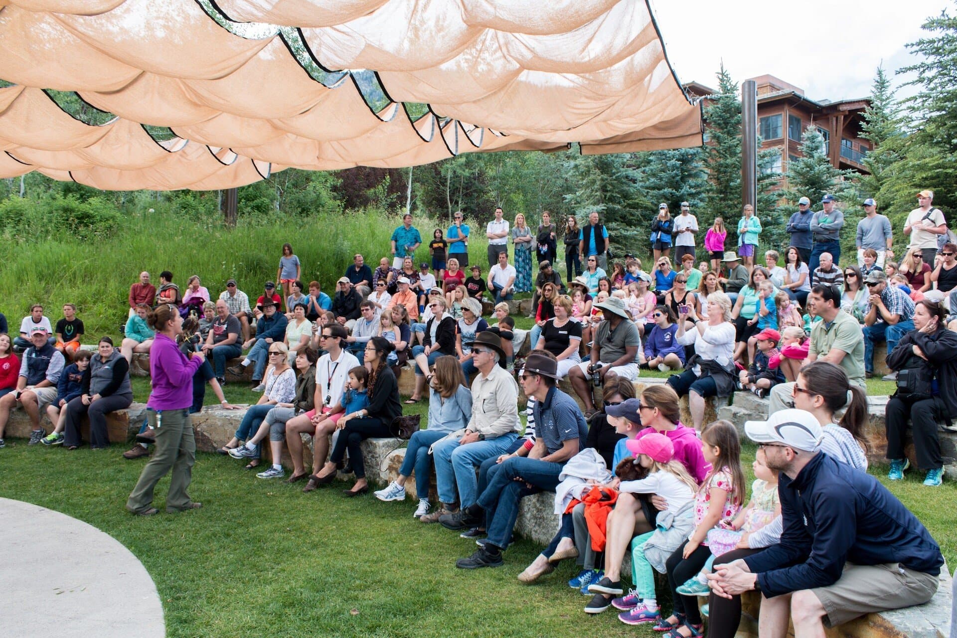 Alive at Five introduction speaker addressing crowd at the Teton Raptor Center in Teton Village, Wyoming