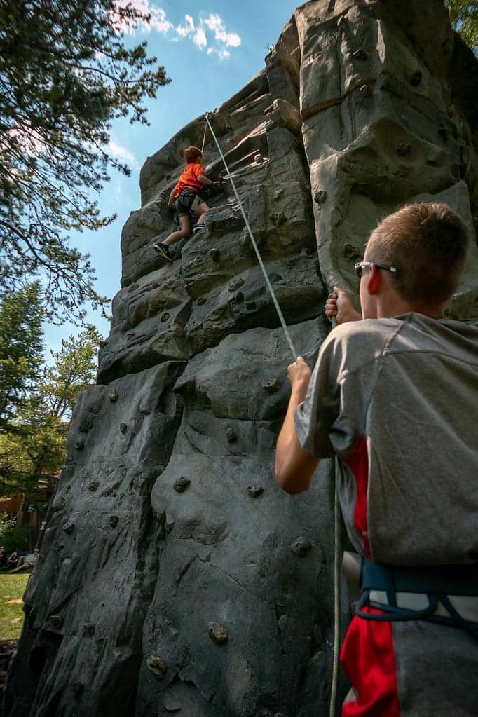 Two children using the climbing wall at Jackson Hole Mountain Resort
