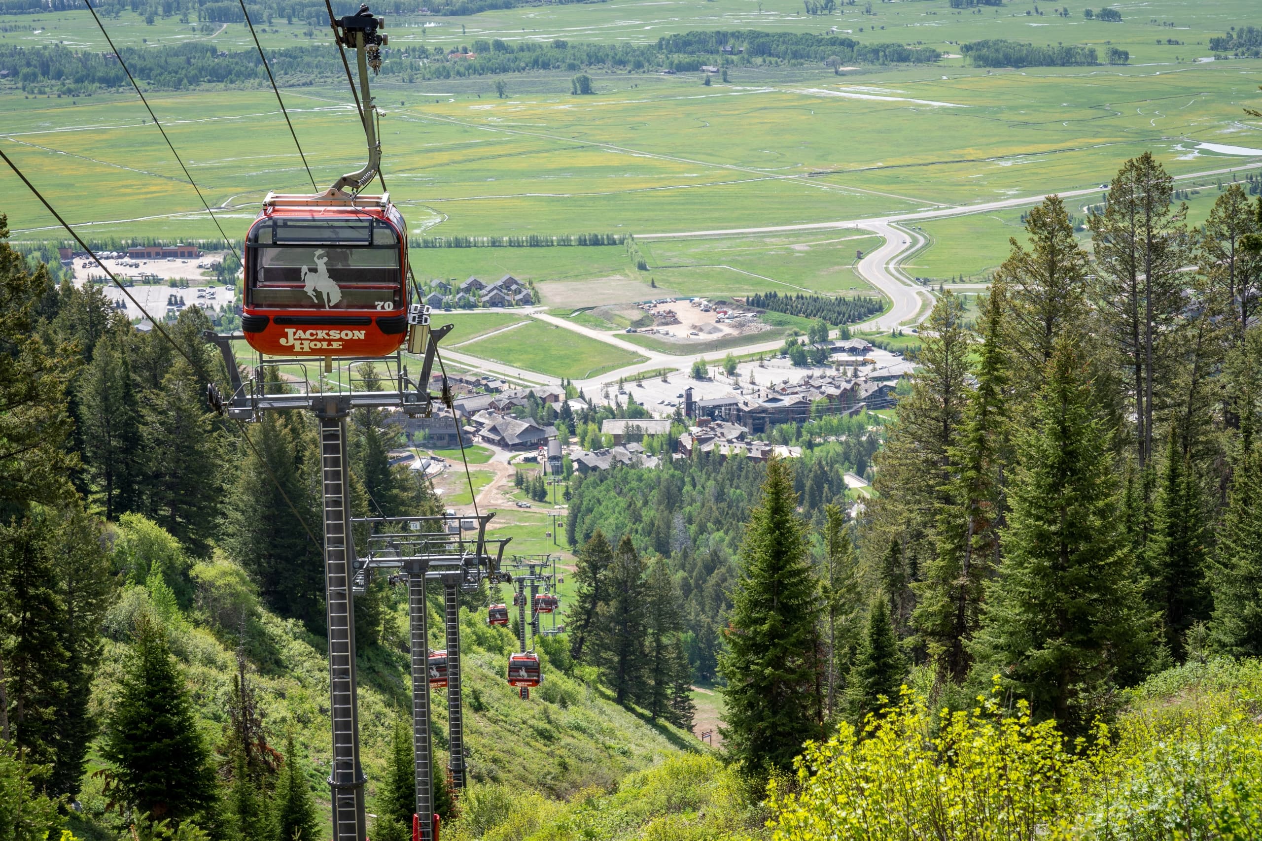 The gondola in Summer heading down to the base of Teton Village in Jackson Hole Wyoming.