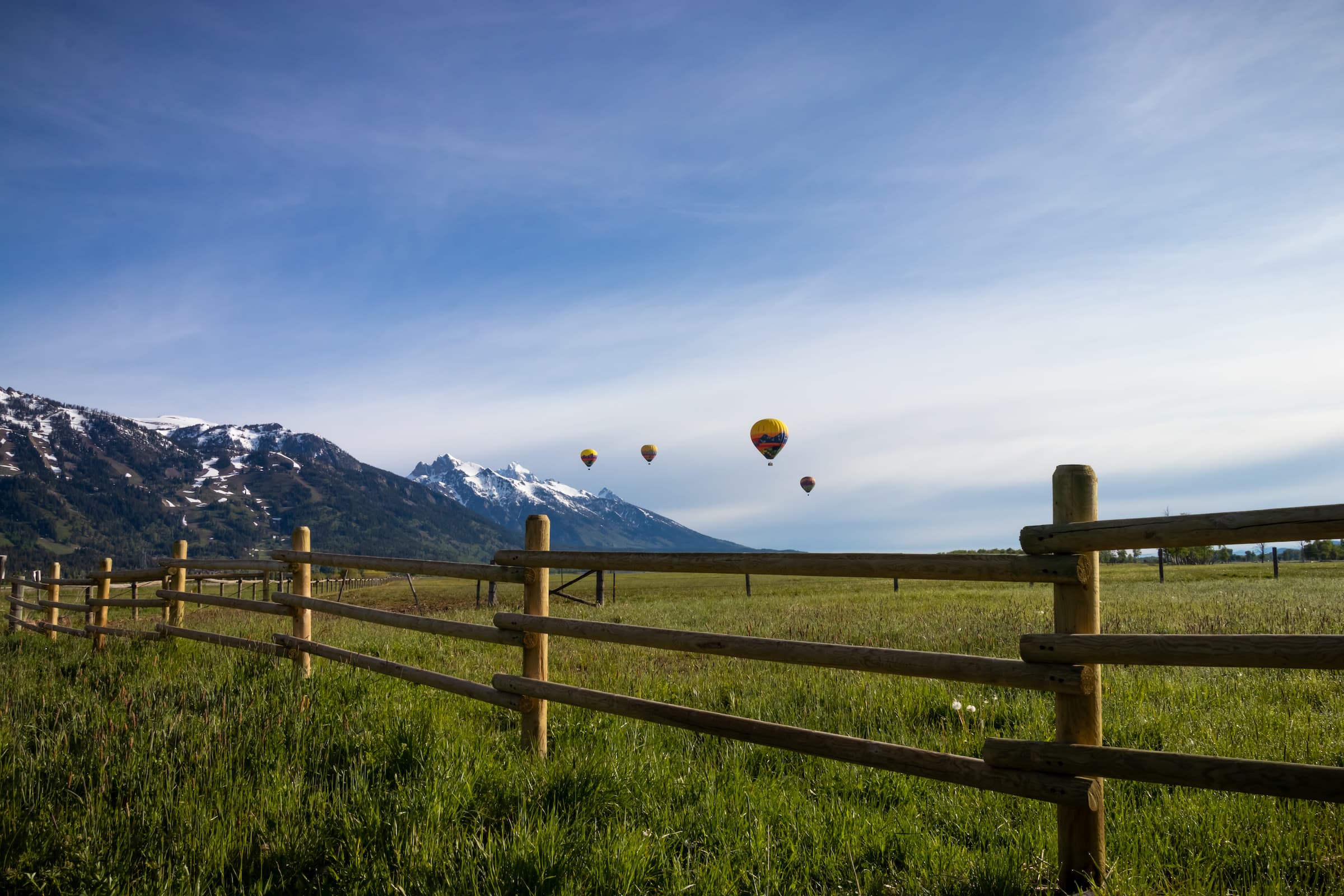 Hot air balloons in the sky in Jackson Hole, Wyoming.