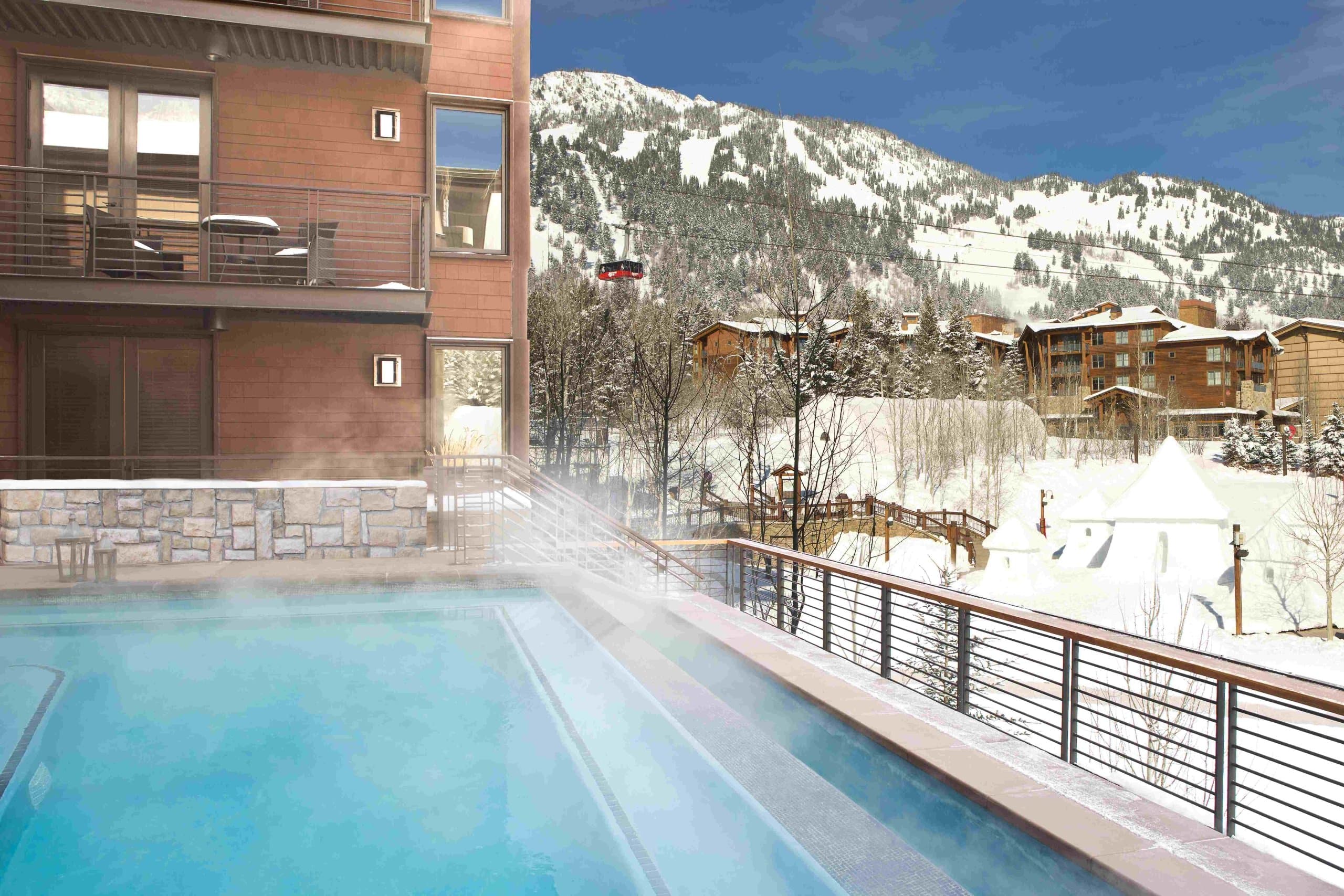 The Infinity Pool with a view of Jackson Hole Mountain in the background is an amenity at Hotel Terra in Wyoming.