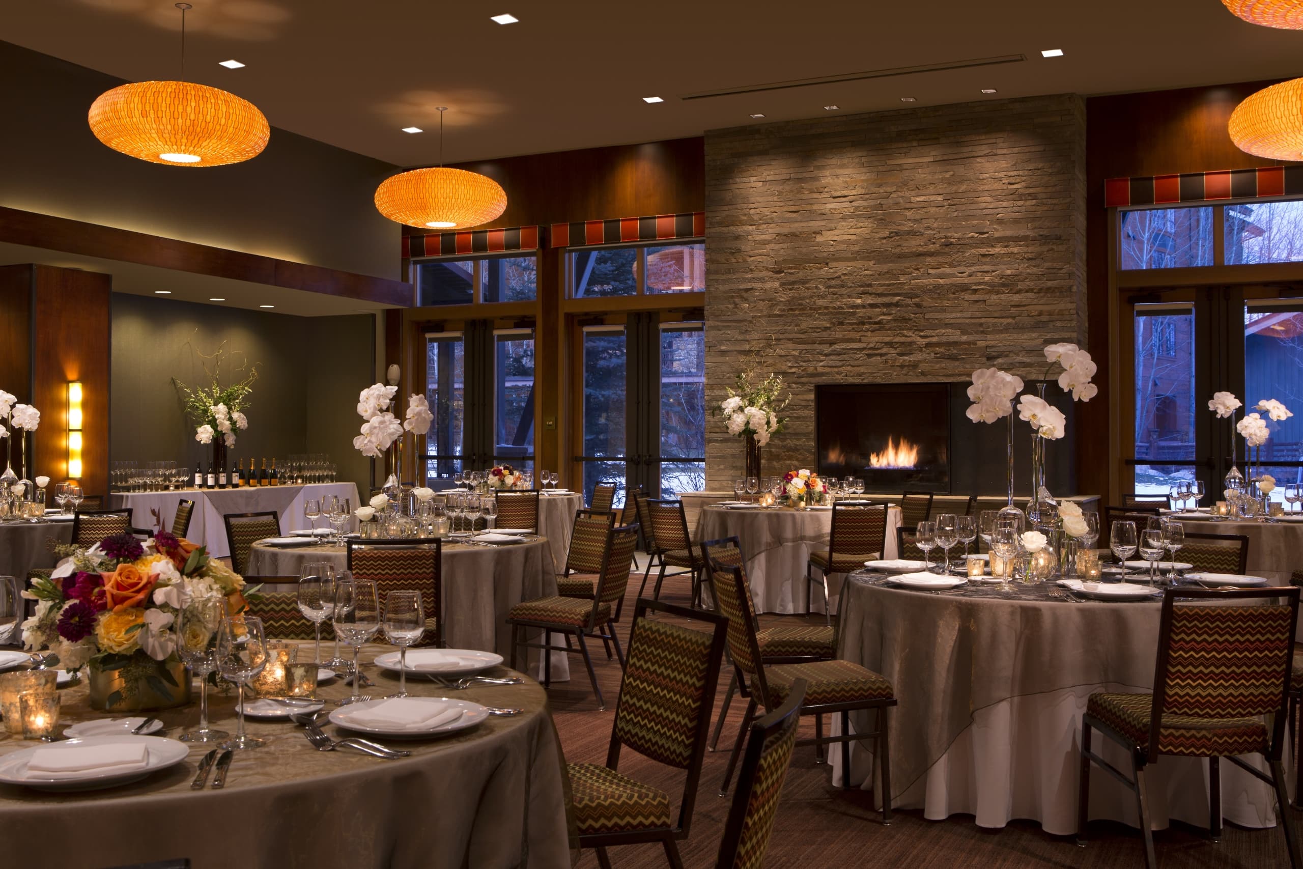 Murie Ballroom seated table arrangement for evening reception event at Hotel Terra in Jackson Hole