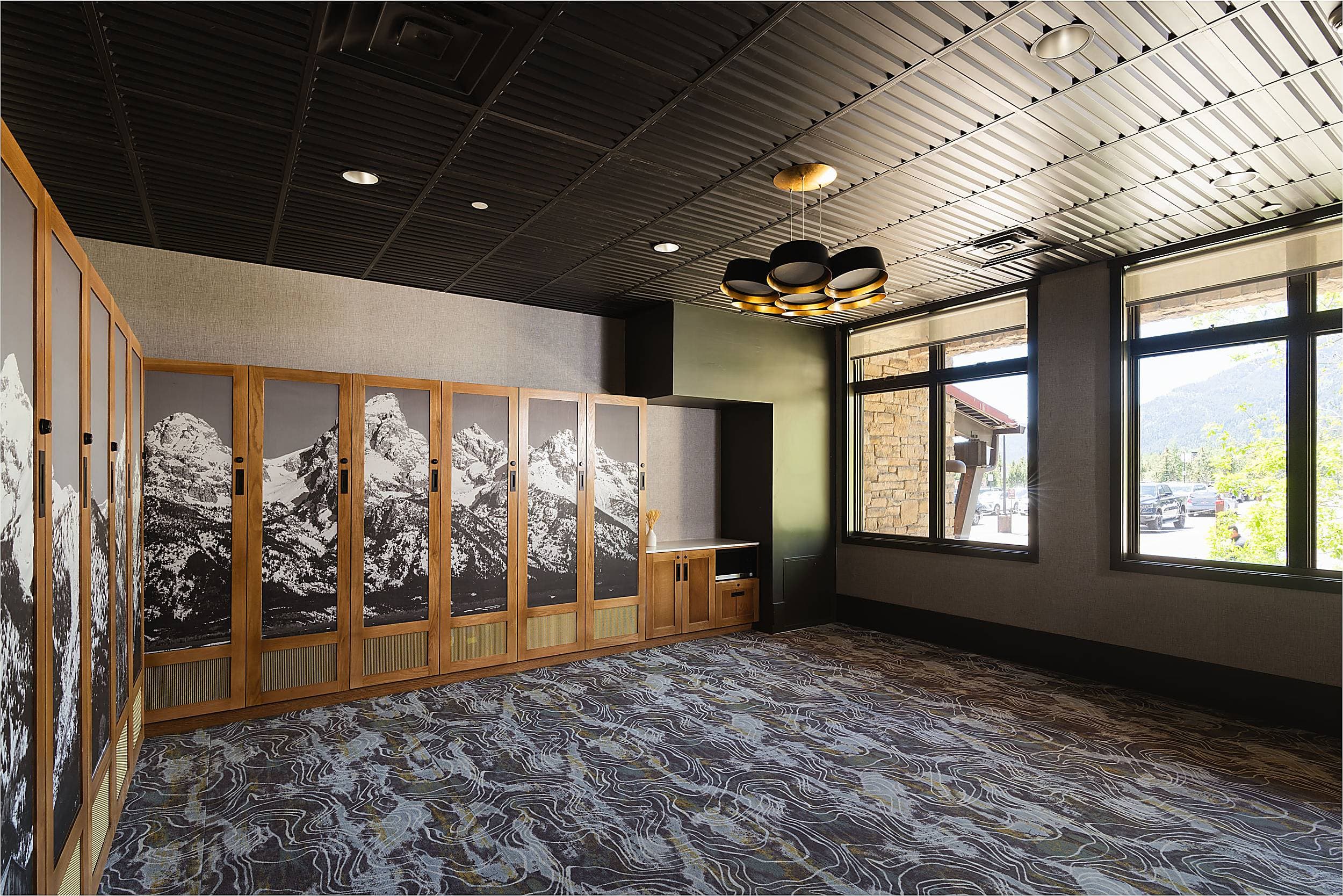 Craighead meeting room at Hotel Terra Jackson Hole with Teton mural panels and mountain views in Teton Village, Wyoming