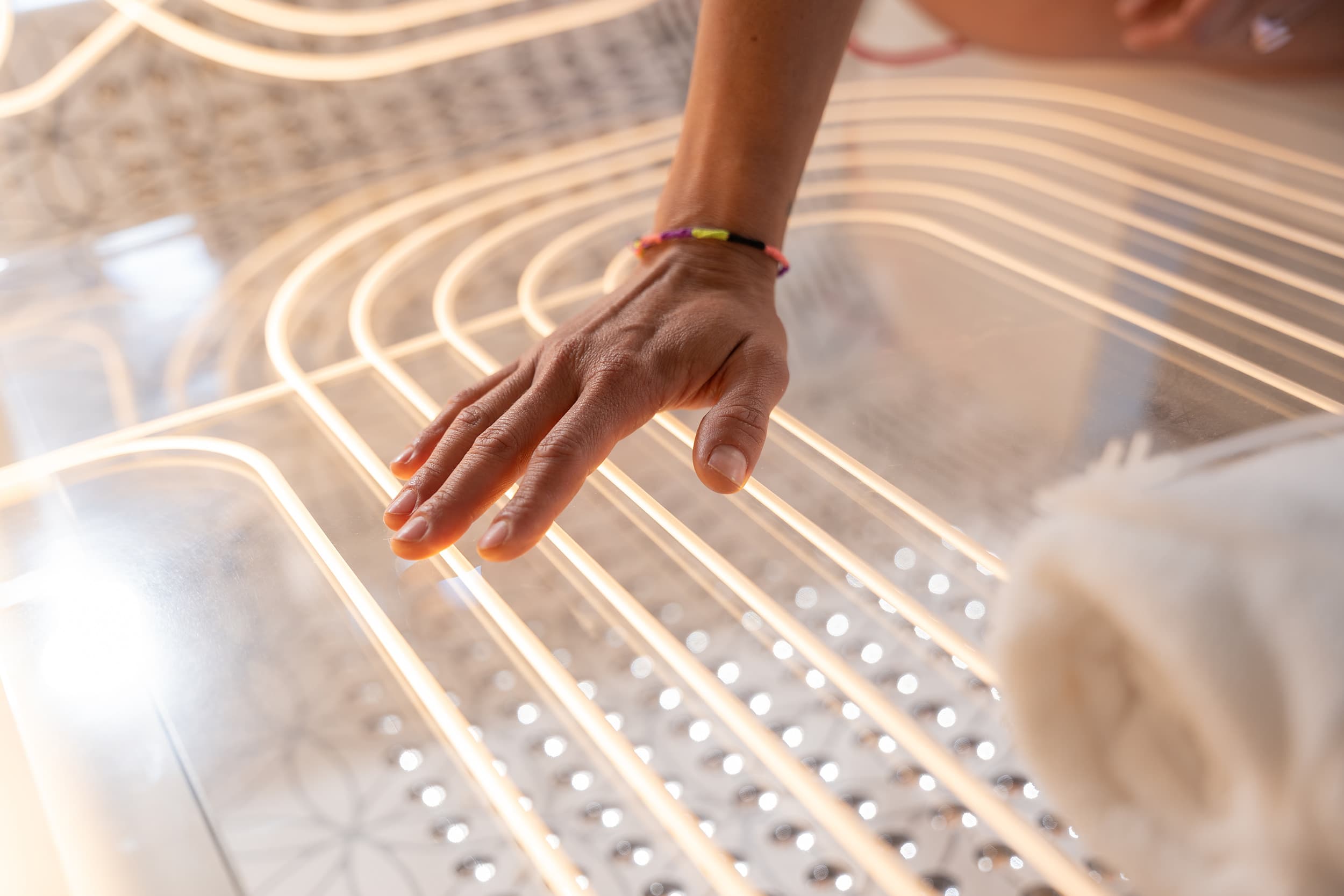 Hand on the lit Ammortal Chamber at Hotel Terra Jackson Hole.