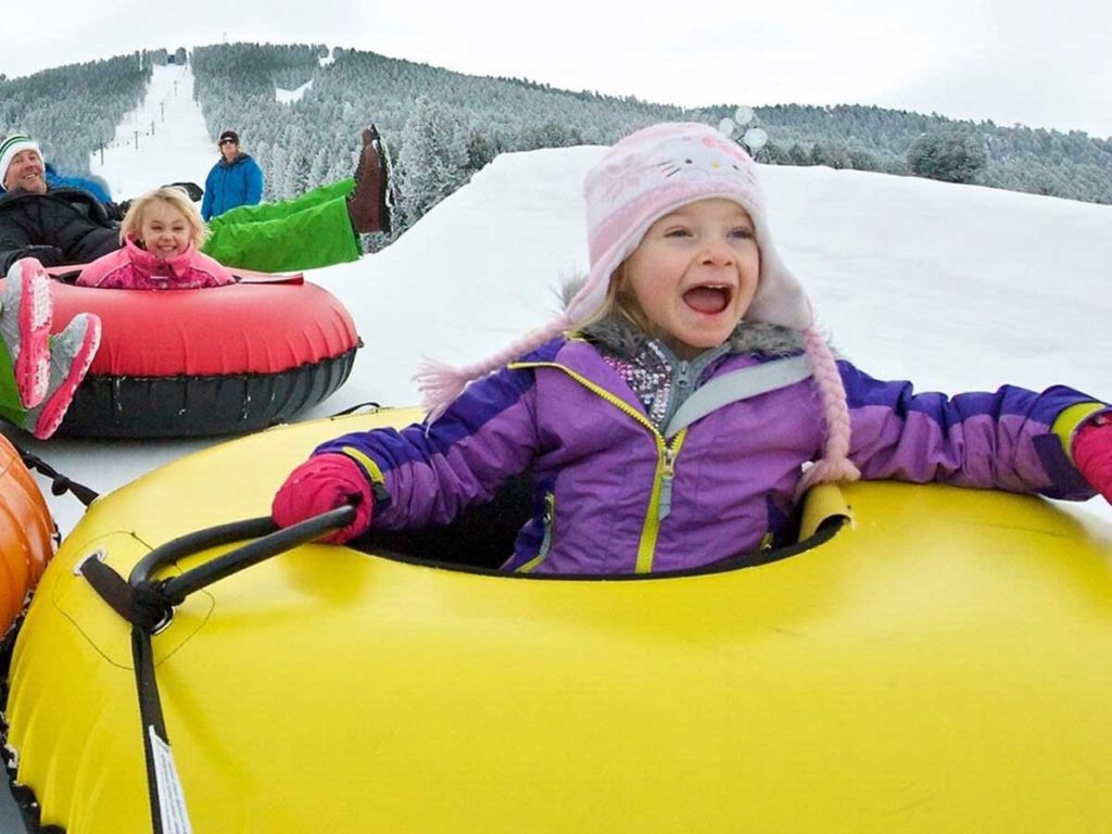 Kids in snow donuts in Jackson Hole, WY