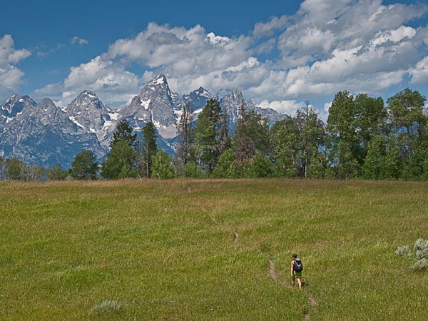 Woman hiking near the Tetons.