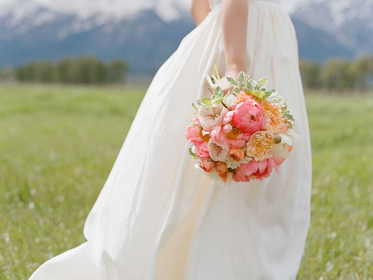 Bride In A Field With A Bouquet.